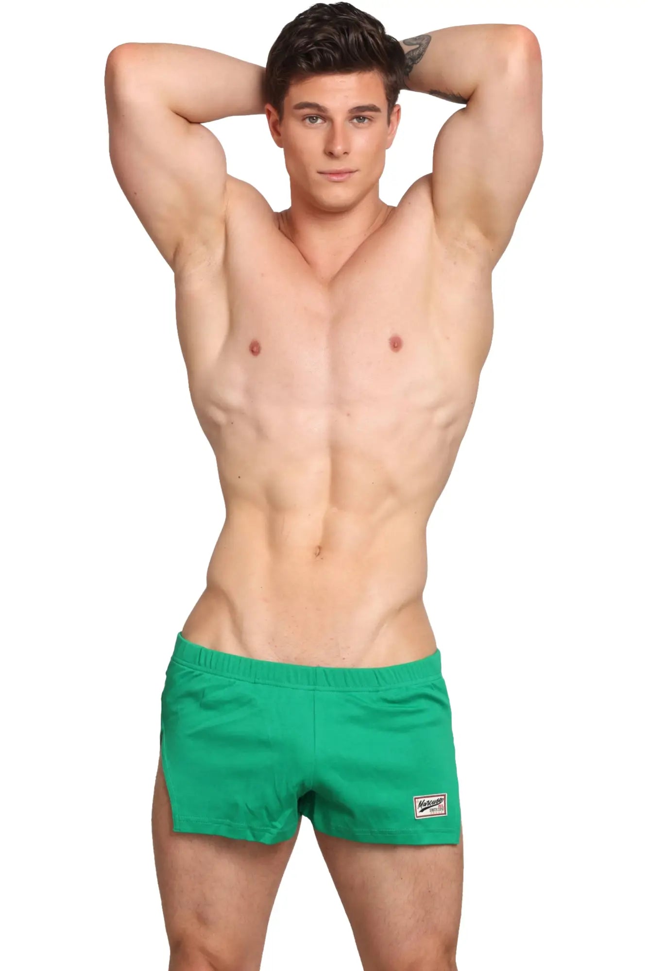 Bright green marcuse hansar athletic shorts with a small white logo patch on the lower right leg front view