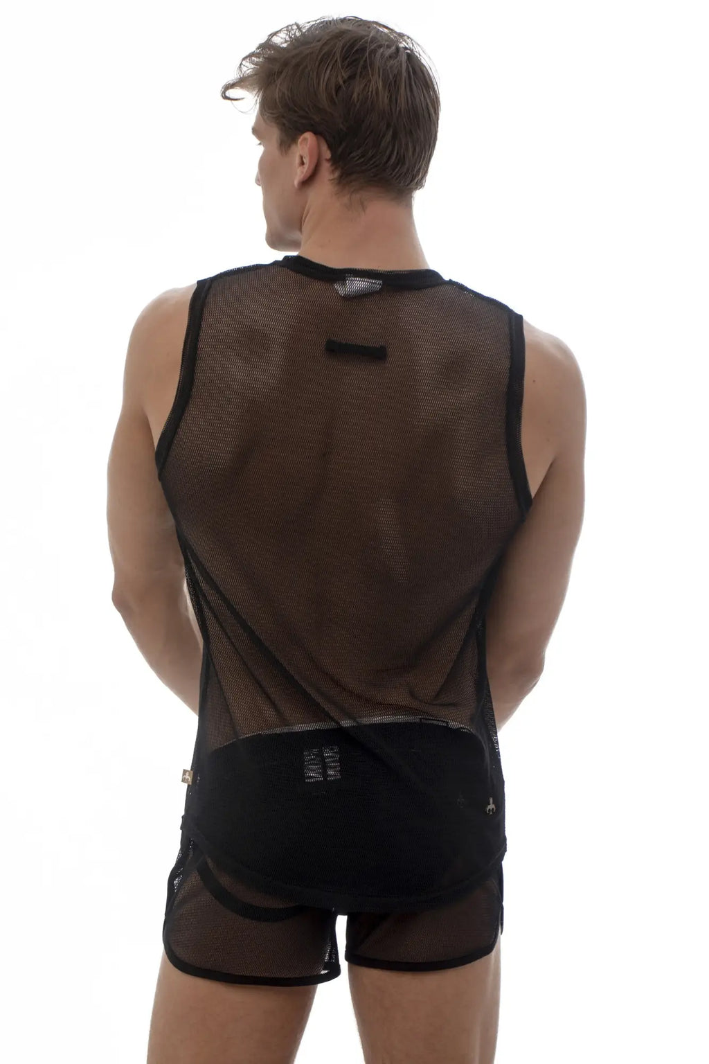 Back view of marcuse hero mesh tank top in black breathable mesh with subtle logo and matching black shorts