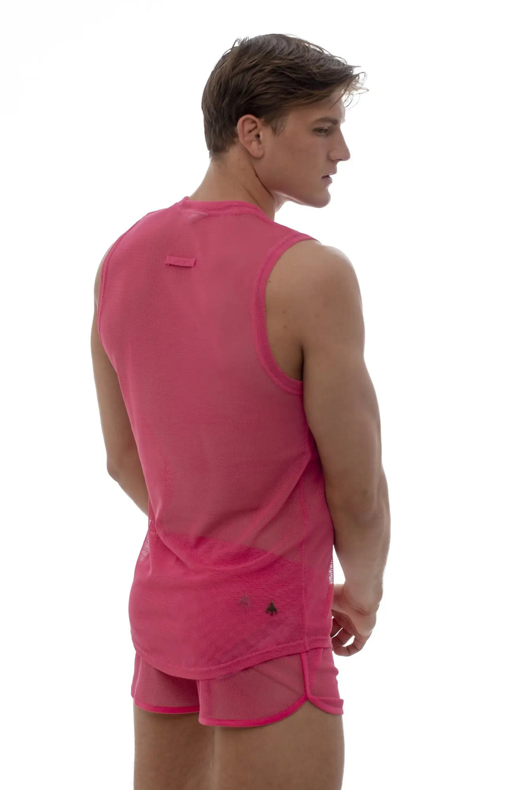 Marcuse Hero mesh tank top in vibrant pink semi-transparent mesh with rounded neckline and subtle black logo detailing