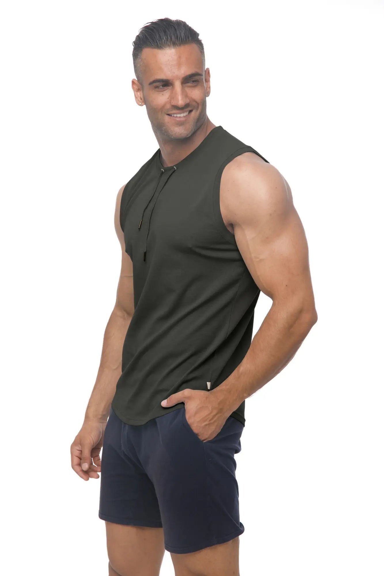 Dark olive green marcuse hero tank top sleeveless athletic top with subtle front placket and brand tag on lower right side
