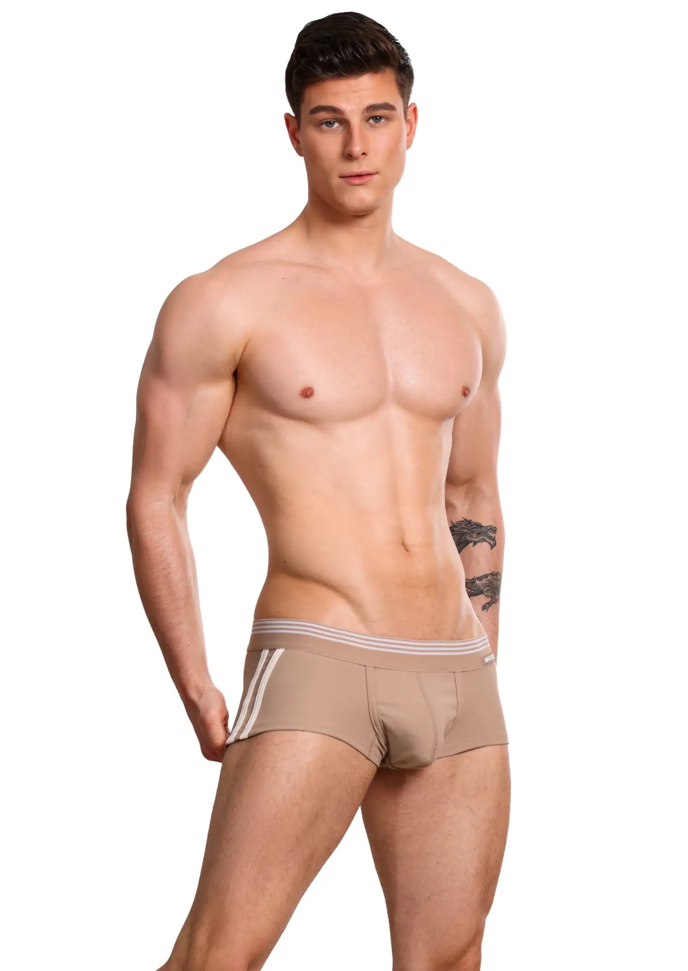Beige Marcuse Huxley boxer underwear with three white side stripes and a matching striped waistband for athletic wear
