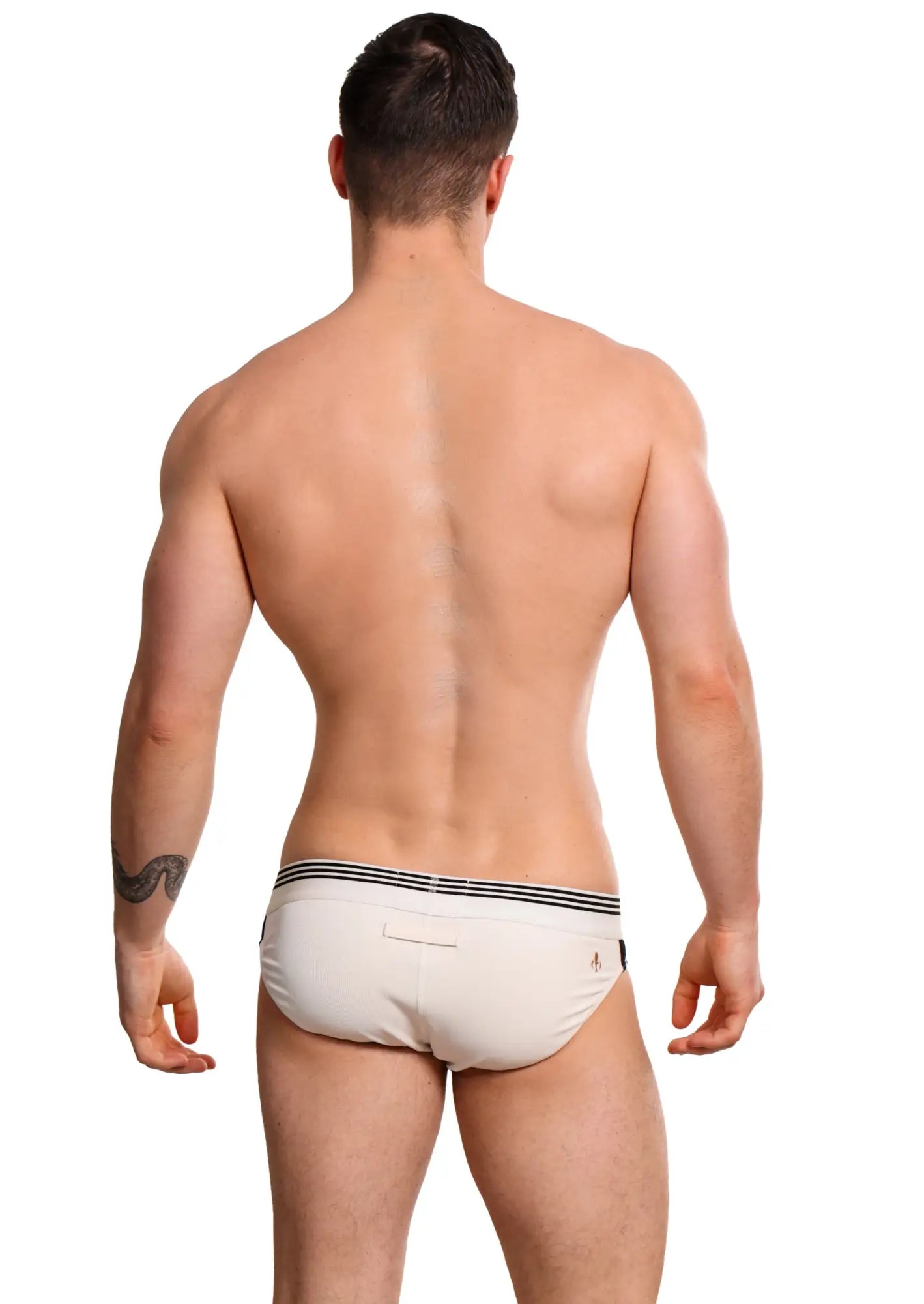 Cream-colored Marcuse Huxley brief underwear with three black horizontal stripes on the waistband for comfortable wear