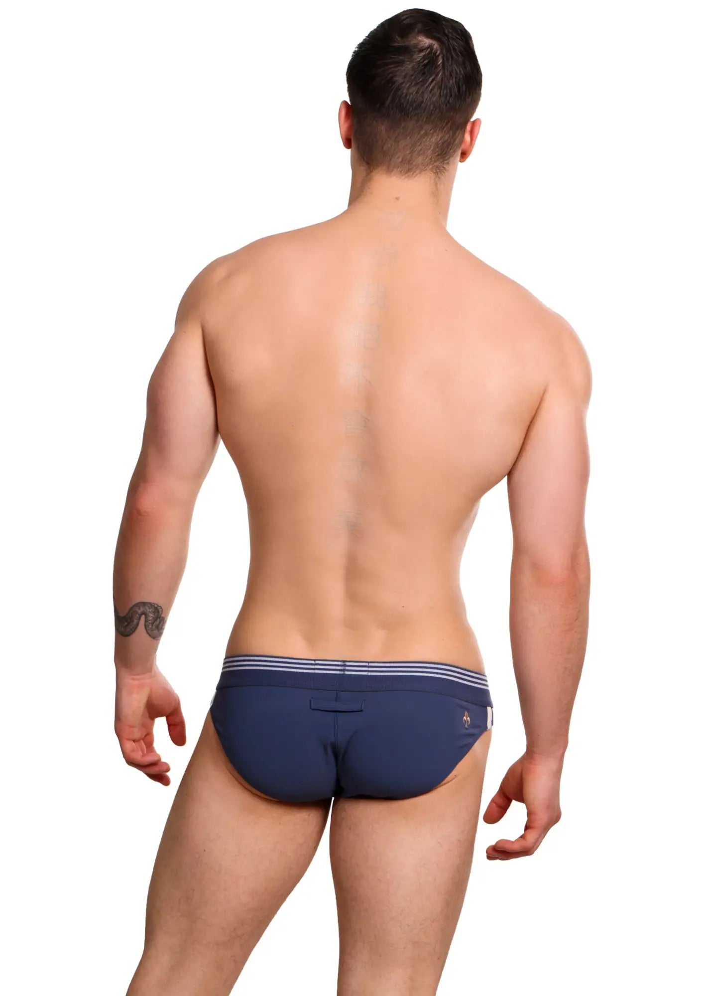 Navy blue Marcuse Huxley brief underwear with white striped waistband and small logo on the side