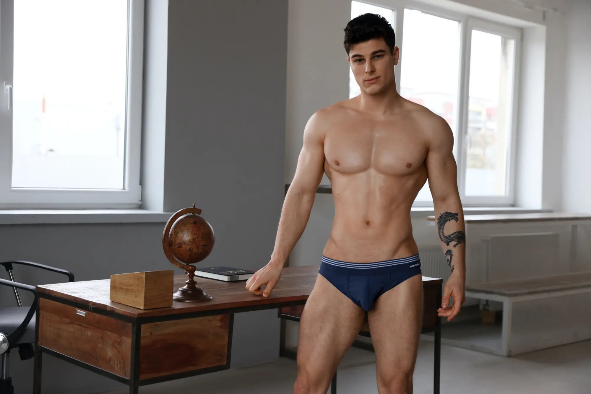Marcuse Huxley brief underwear in navy blue with white and light blue striped trim for comfortable daily wear
