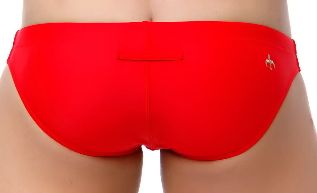 Bright red Marcuse Inflate bikini swimwear swim trunks with small metallic banana logo on the right hip
