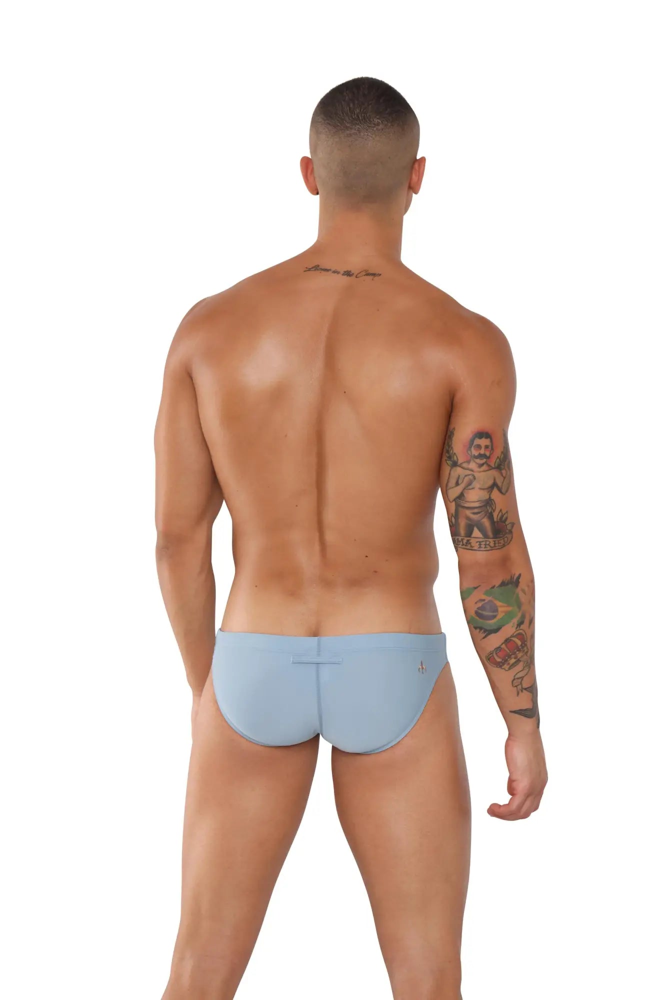 Light blue marcuse inflate bikini swimwear form-fitting swim trunks showing subtle seam detail at the back