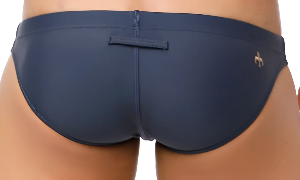 Marcuse Inflate bikini swimwear navy blue swim trunks with gold logo and central back strap shown from the back side