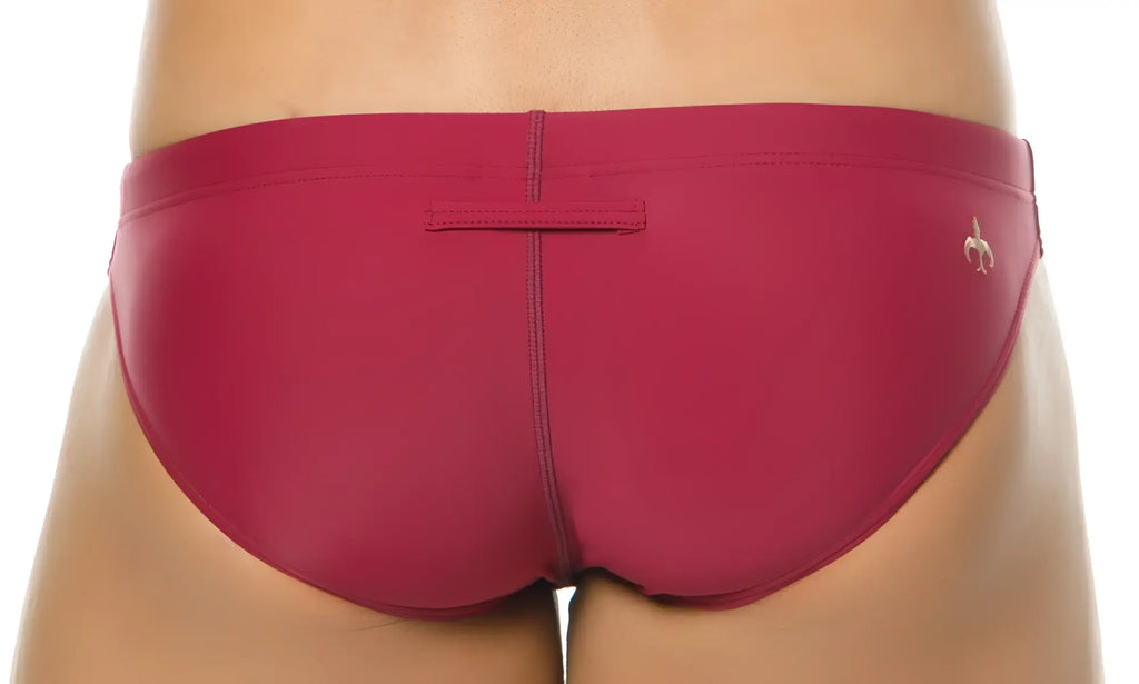 Marcuse inflate bikini swimwear sleek fuchsia swim trunks with subtle gold logo on the side
