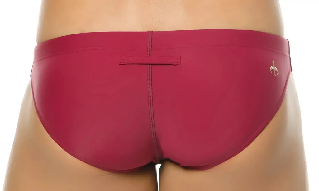 Marcuse inflate bikini swimwear sleek fuchsia swim trunks with subtle gold logo on the side