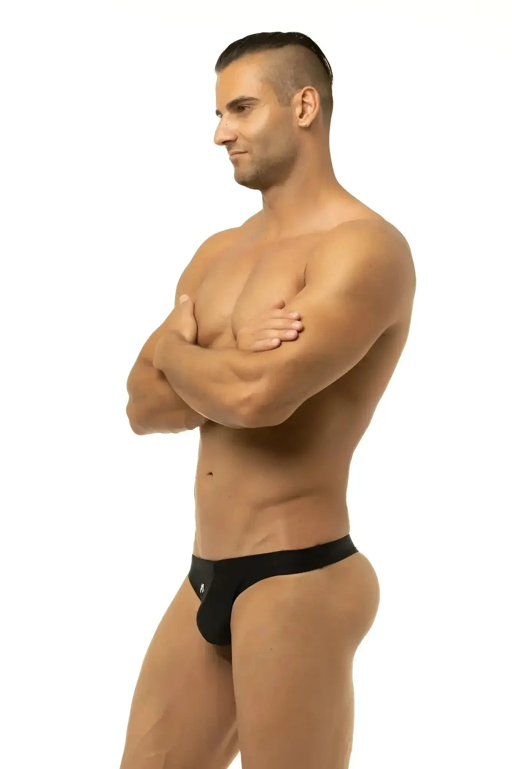 Black form-fitting briefs with a sleek minimalist design from Marcuse Inflate thong swimwear collection.