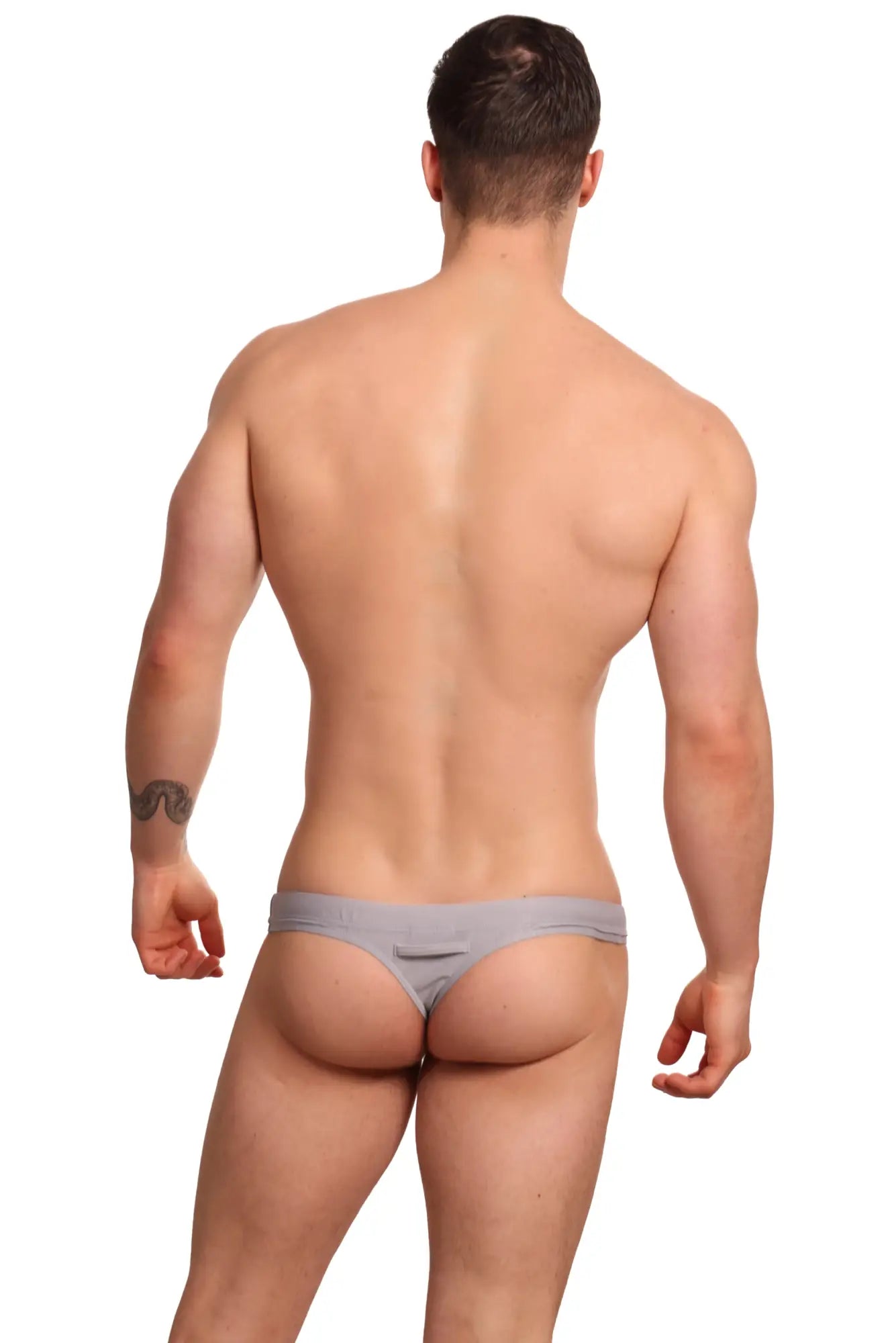 Gray minimalist Marcuse Inflate thong swimwear shown from the back with subtle seam detail