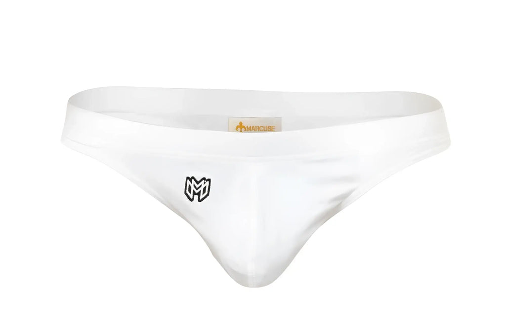 White mens thong swimwear with black embroidered logo on front and orange marcuse brand tag at waistband