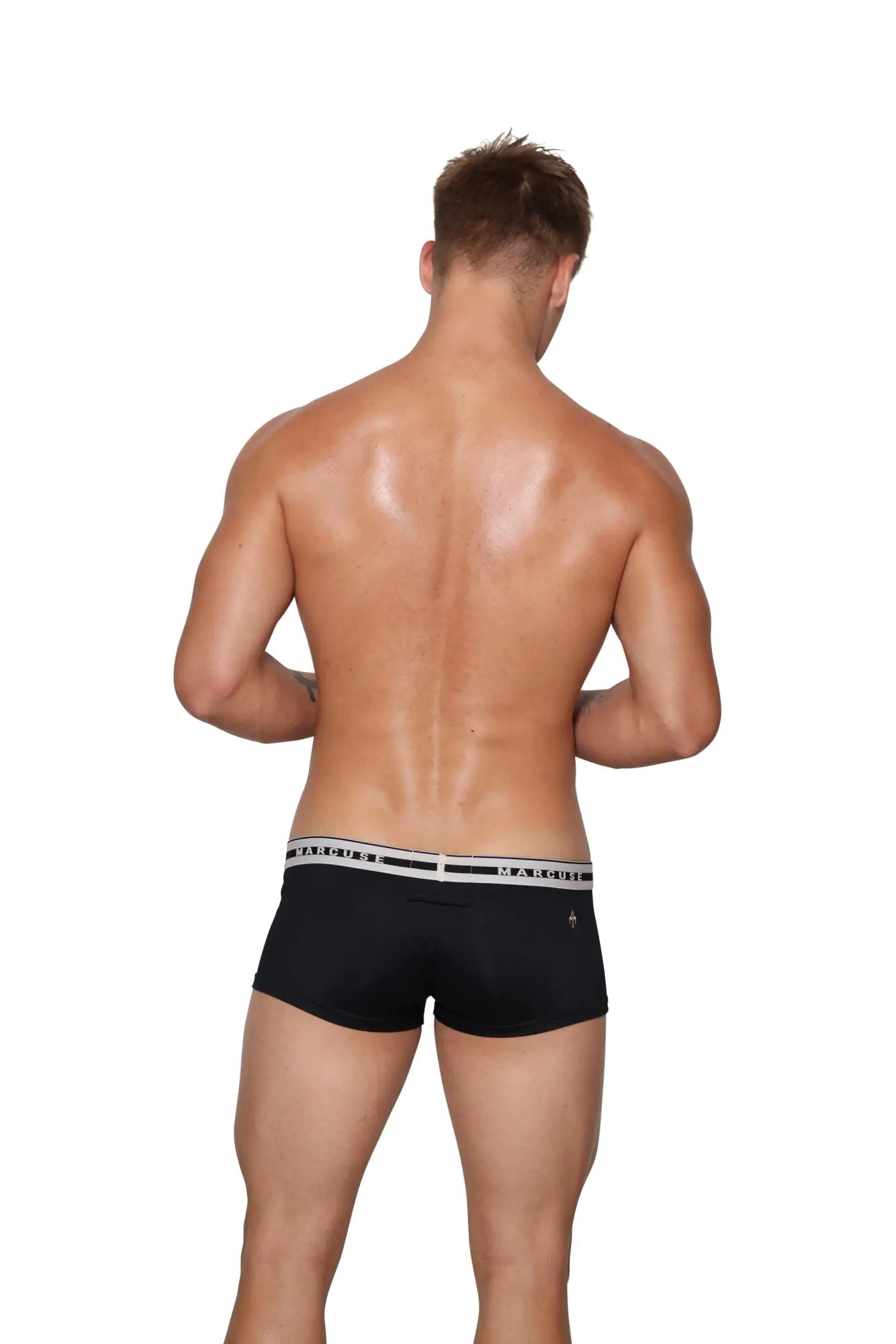 Marcuse intimate black men’s briefs with white elastic waistband and black men’s branding for comfortable everyday wear