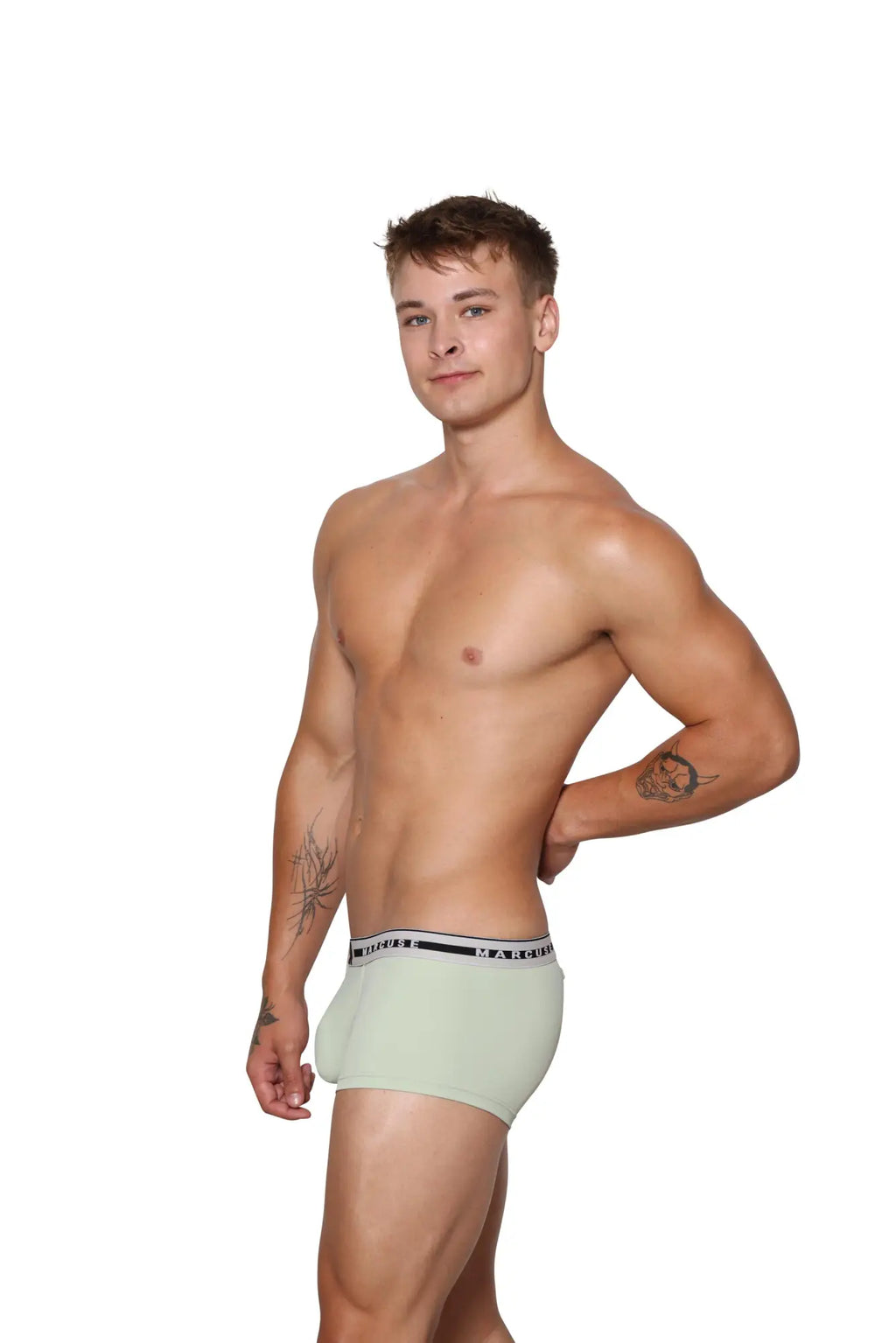 Light green cotton marcuse intimate boxer briefs with white elastic waistband and black text with thin stripes