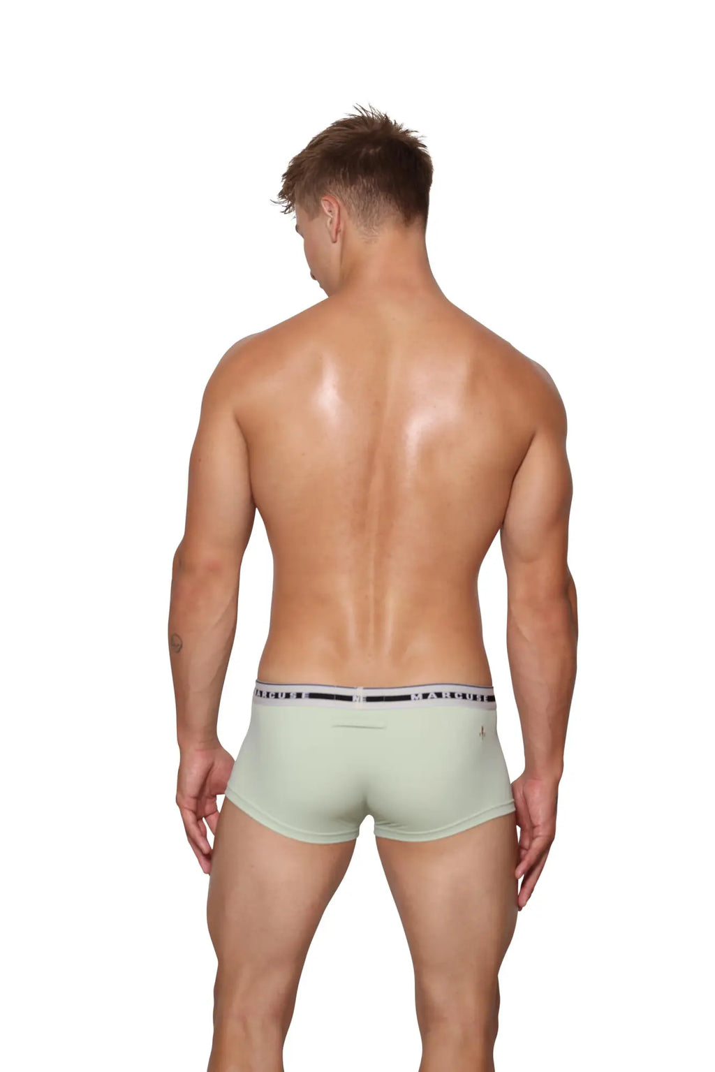 Light green marcuse intimate men’s boxer briefs with black and white striped waistband featuring brand name