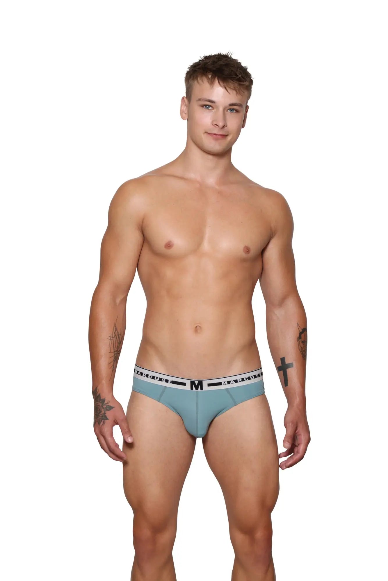 Light blue marcuse intimate brief underwear with white elastic waistband featuring black lettering and m logo