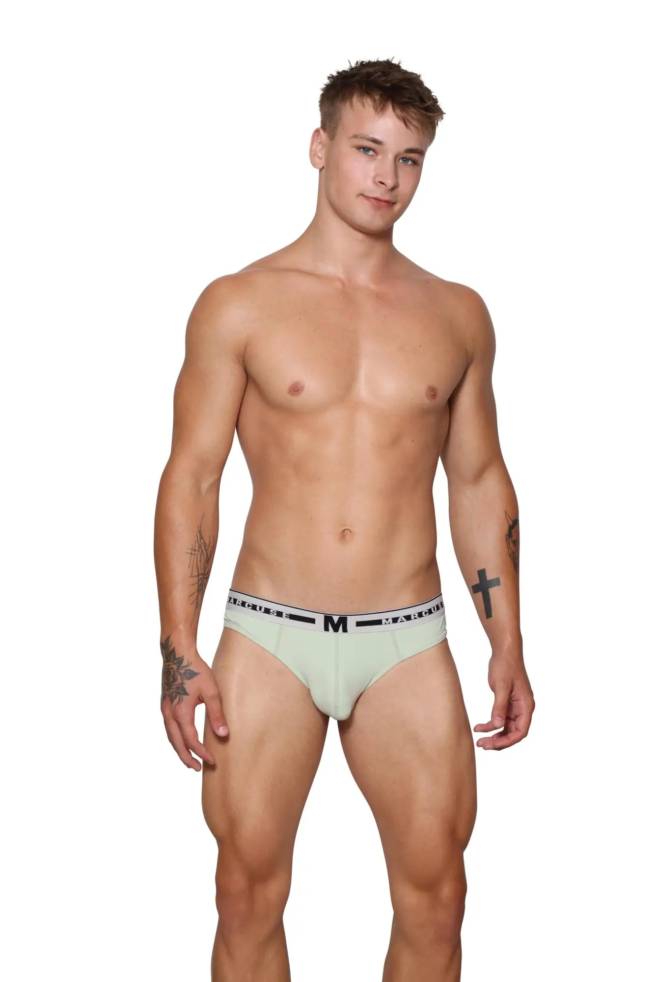 Light green Marcuse intimate brief underwear with black waistband featuring letter m and repeating text design