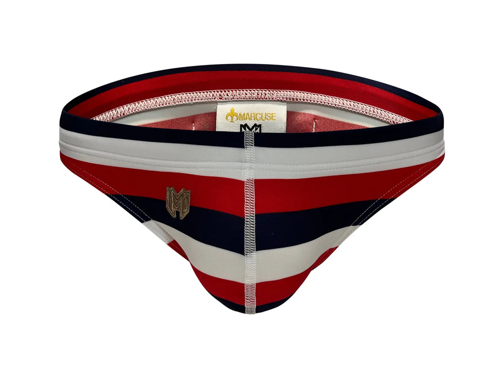Marcuse Journée thong swimwear men’s briefs with red white and navy blue stripes and a gold logo on the front