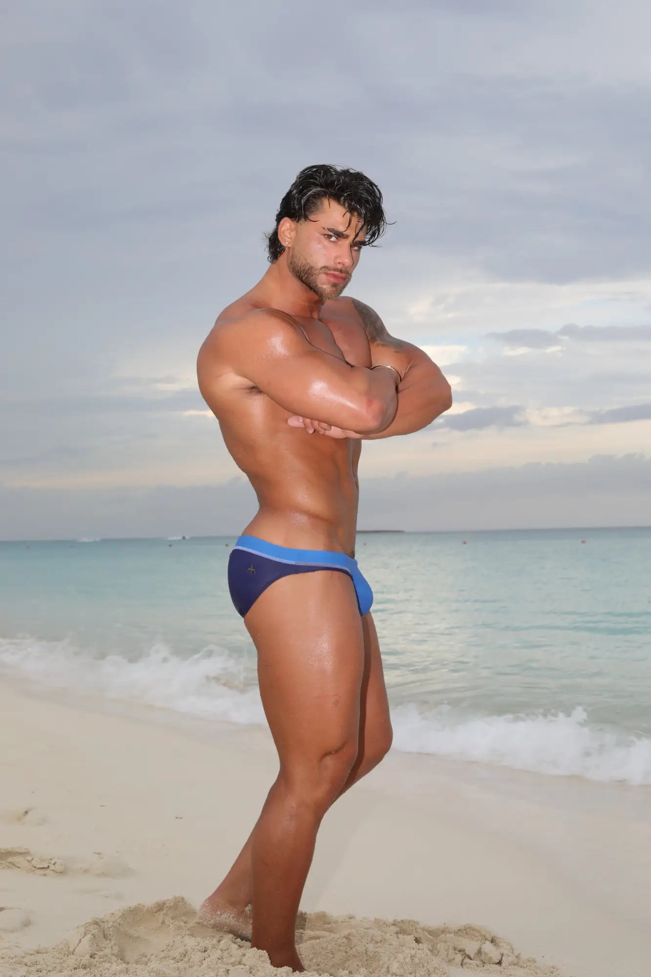 Blue swim trunks from marcuse joyeux bikini swimwear with a contrasting lighter blue waistband for beach use