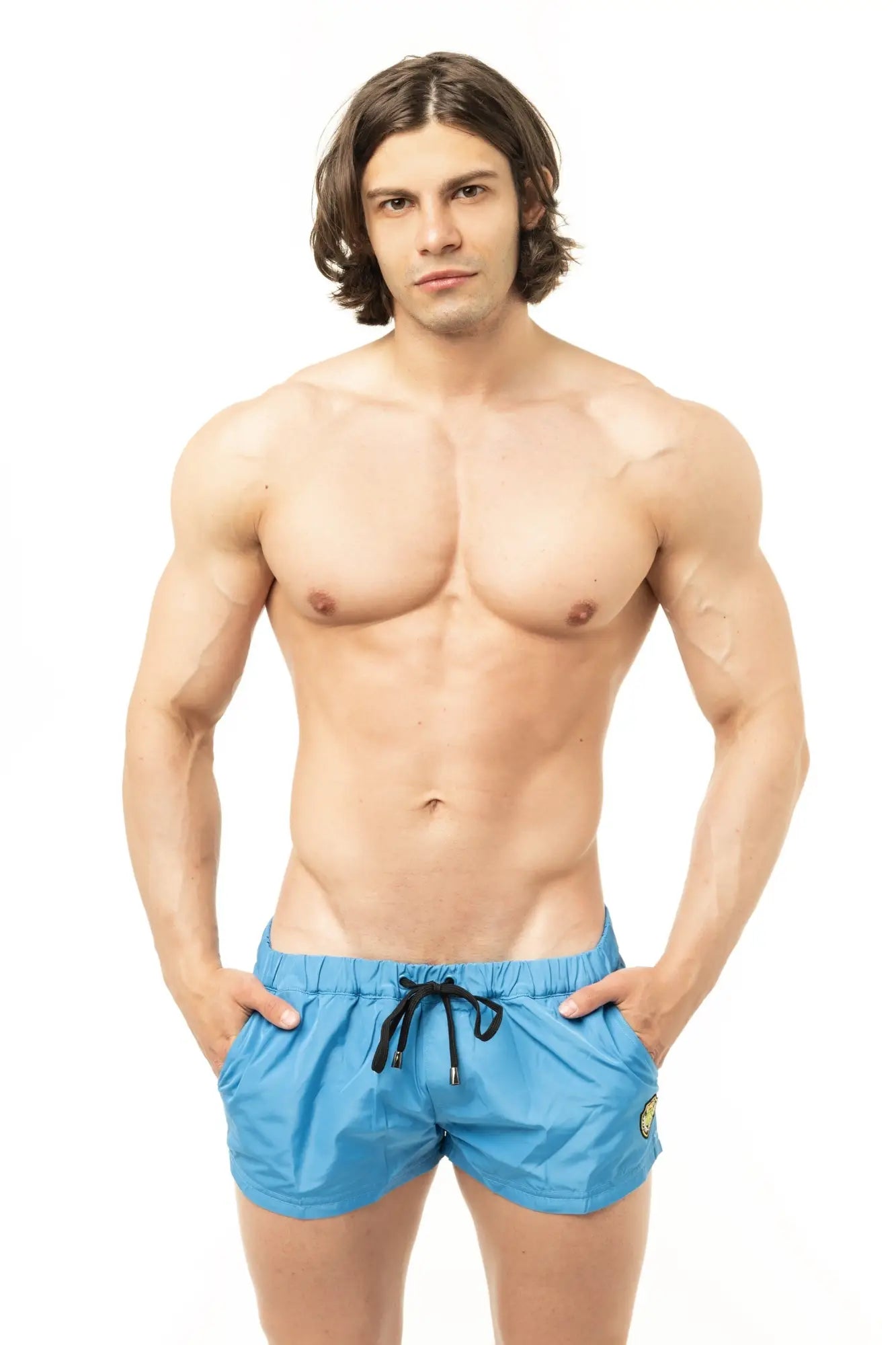 Marcuse League shorts bright blue swim trunks with black drawstrings and a small yellow logo on the side