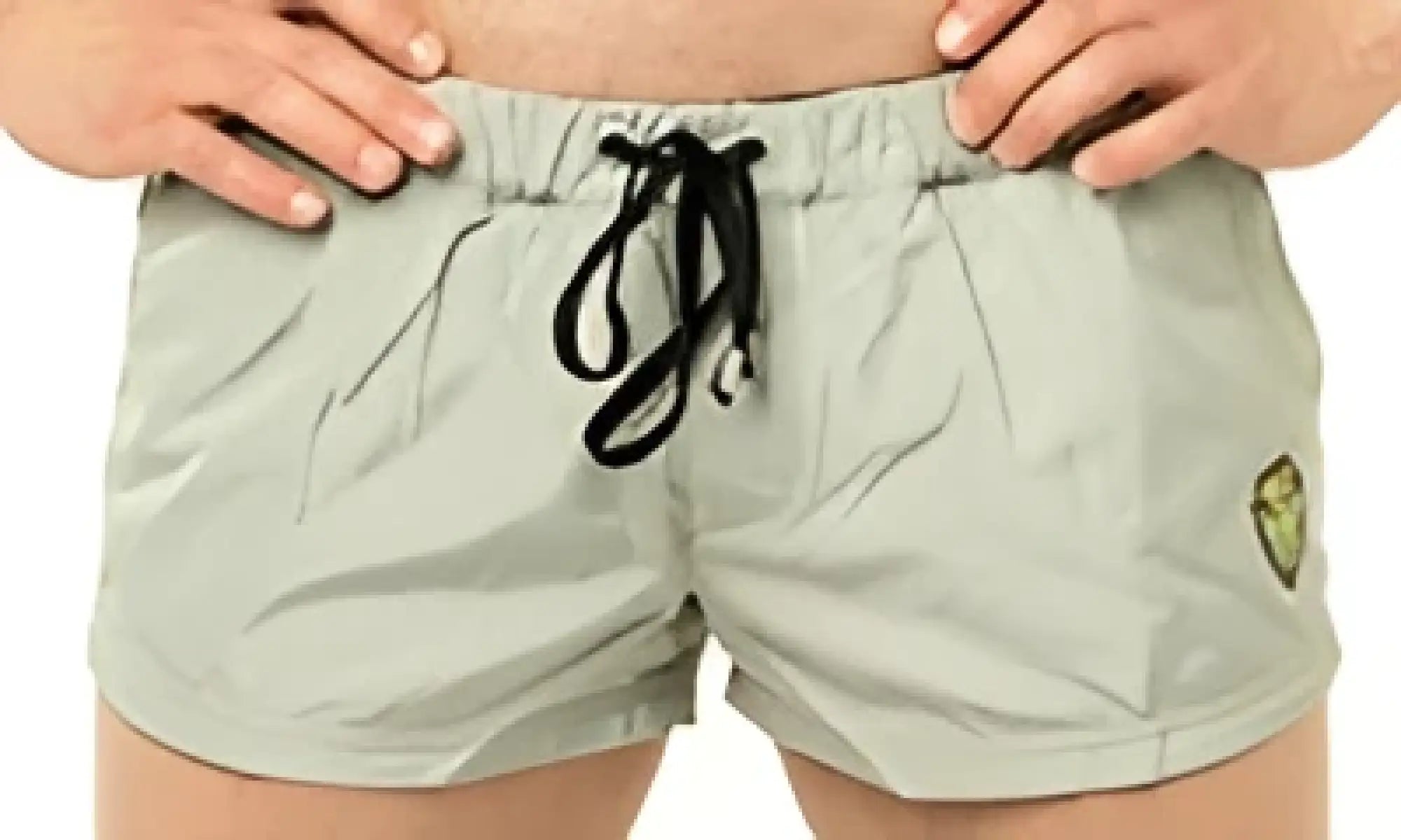 Marcuse league shorts khaki cargo shorts with black drawstrings and a small yellow logo on the left thigh