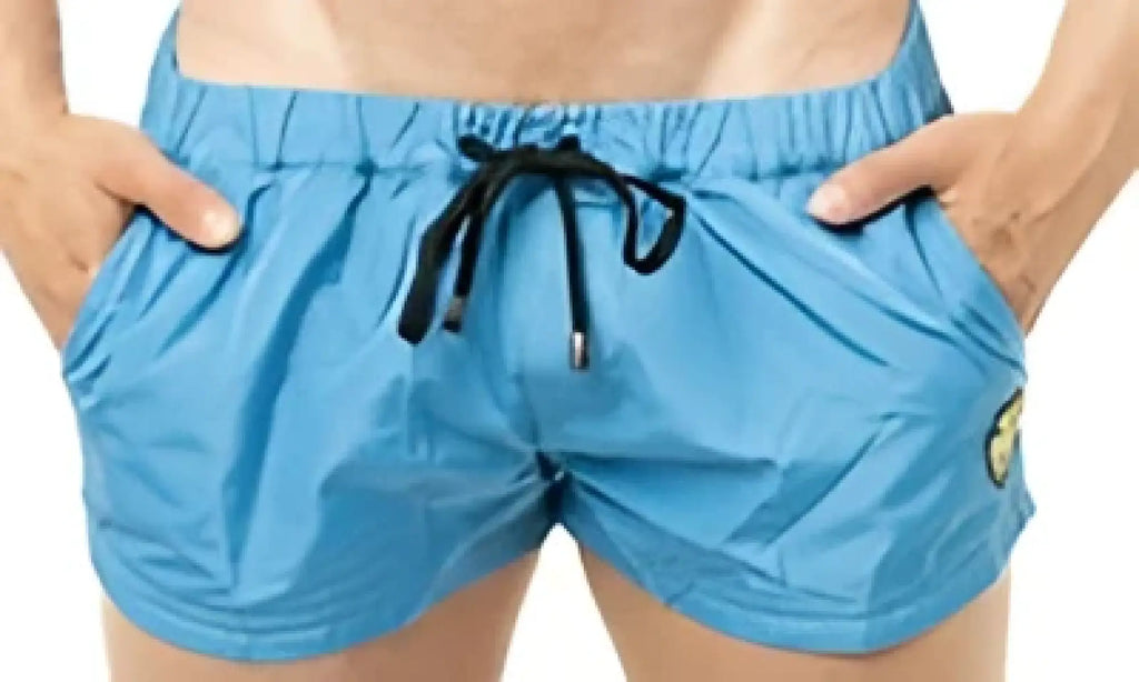 Marcuse league shorts light blue lightweight swim trunks with drawstring waistband and small green logo on left leg