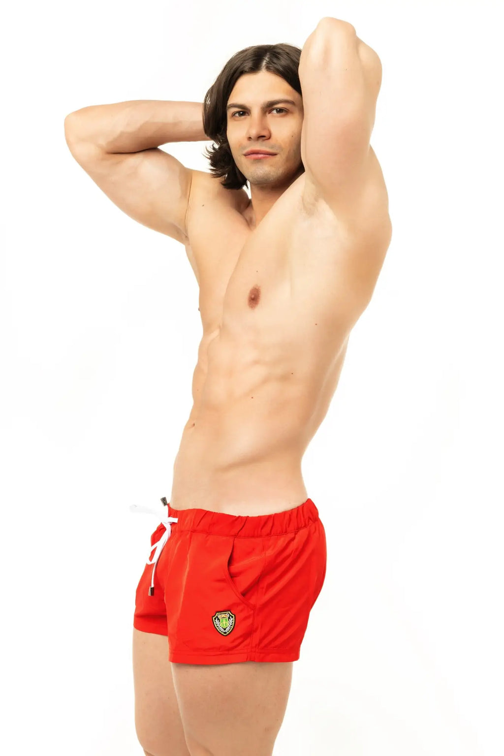 Red swim trunks marcuse league shorts with small embroidered logo on the left leg for swimming and beachwear
