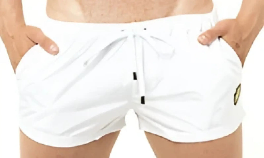 White marcuse league shorts with drawstring waistband and subtle side stripes for swimming and beachwear