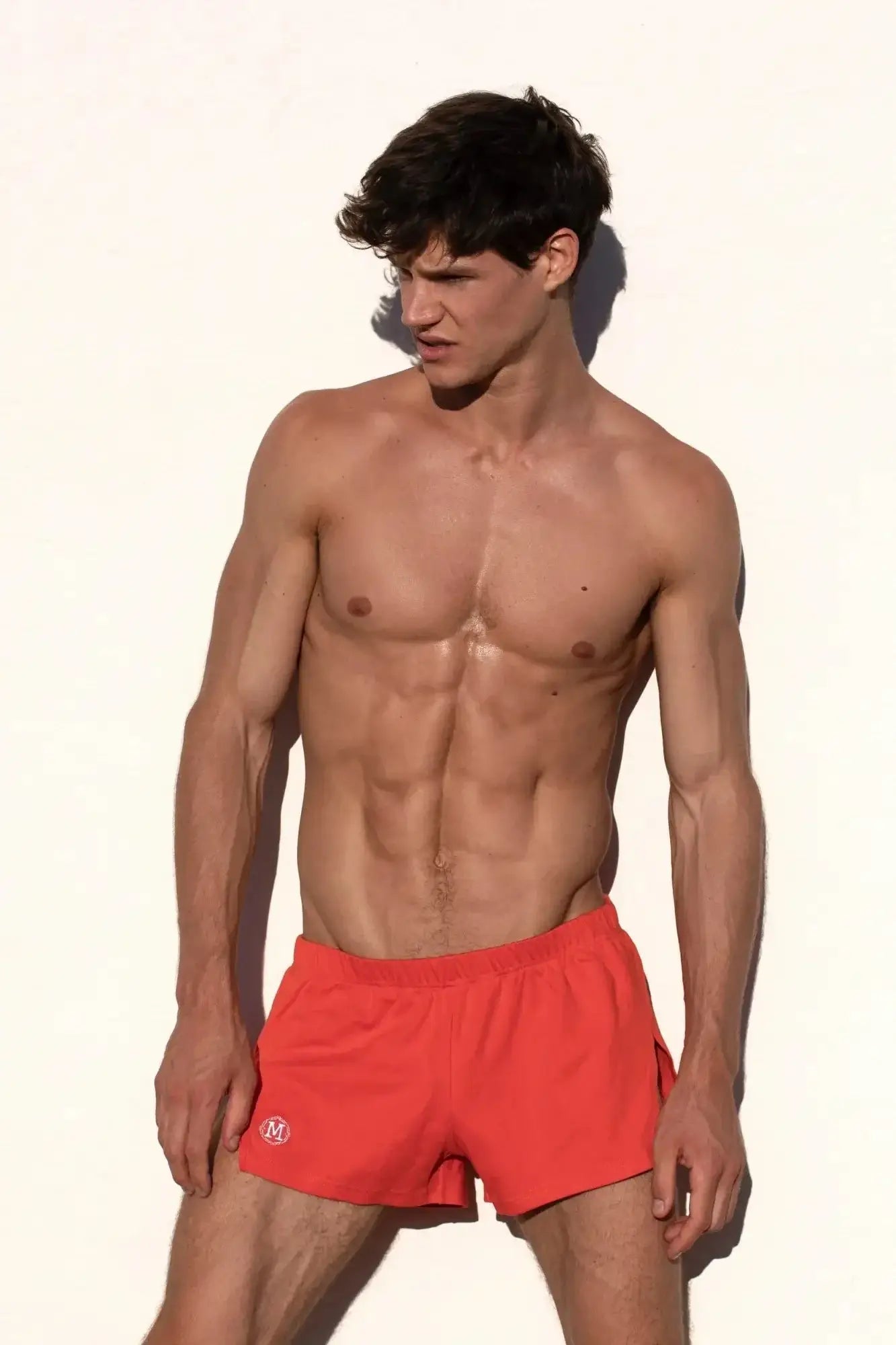 Marcuse leisure shorts in bright red with a small white logo on the left leg, athletic and lightweight material