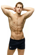 Black marcuse leisure shorts with a small white logo on the left leg made from lightweight breathable fabric