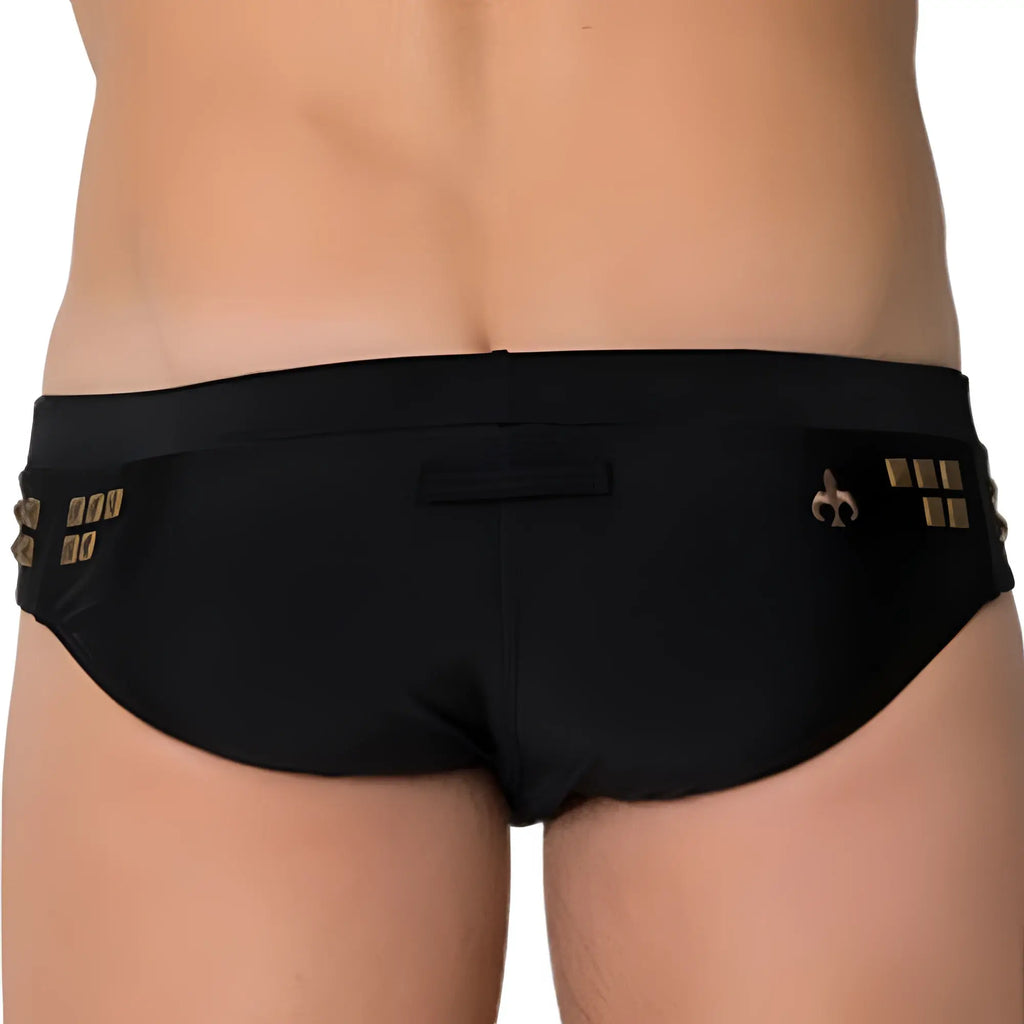 Black Marcuse MA_Stud swimwear trunks with gold metallic embellishments and fleur-de-lis logo on the side