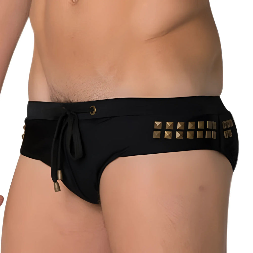 Black Marcuse MA_Stud swim trunks with gold-tone square studs along the waistband and matching drawstring