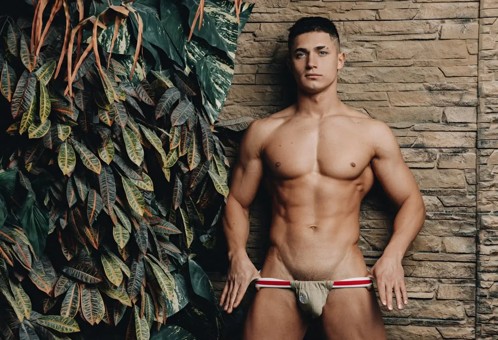 Beige Marcuse Maximo jock underwear with red and white striped waistband made of soft athletic fabric