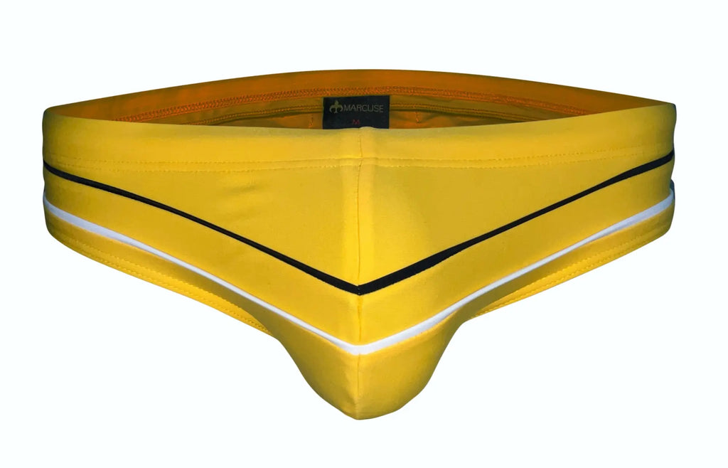 Bright yellow Marcuse Memphis bikini swimwear men’s swim trunks with black and white trim for swimming and beachwear