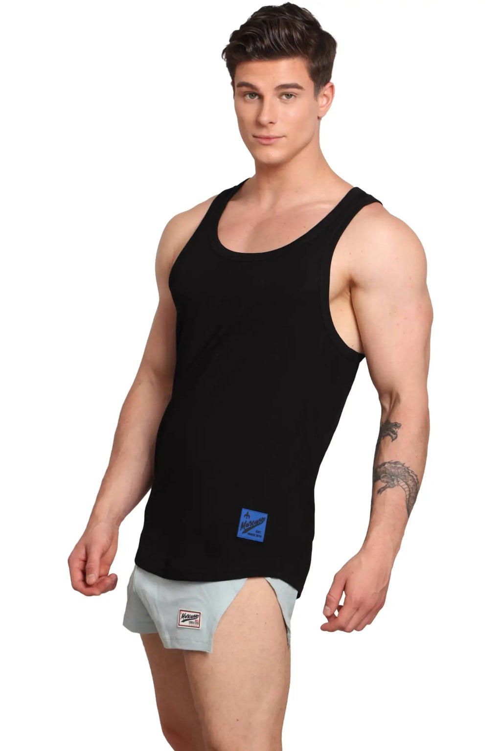 Marcuse monsieur tank top black sleeveless with a small blue rectangular brand label on the lower front