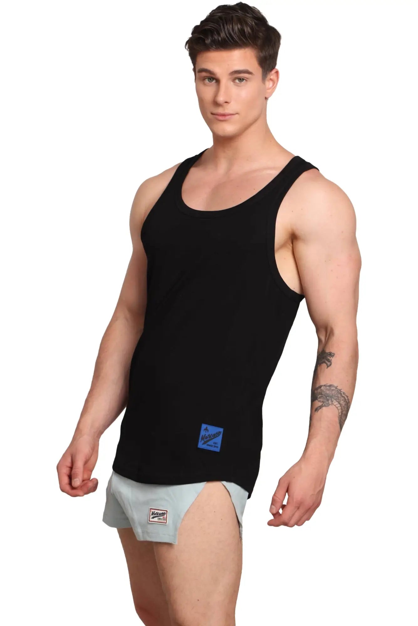 Marcuse monsieur tank top black sleeveless with a small blue rectangular brand label on the lower front