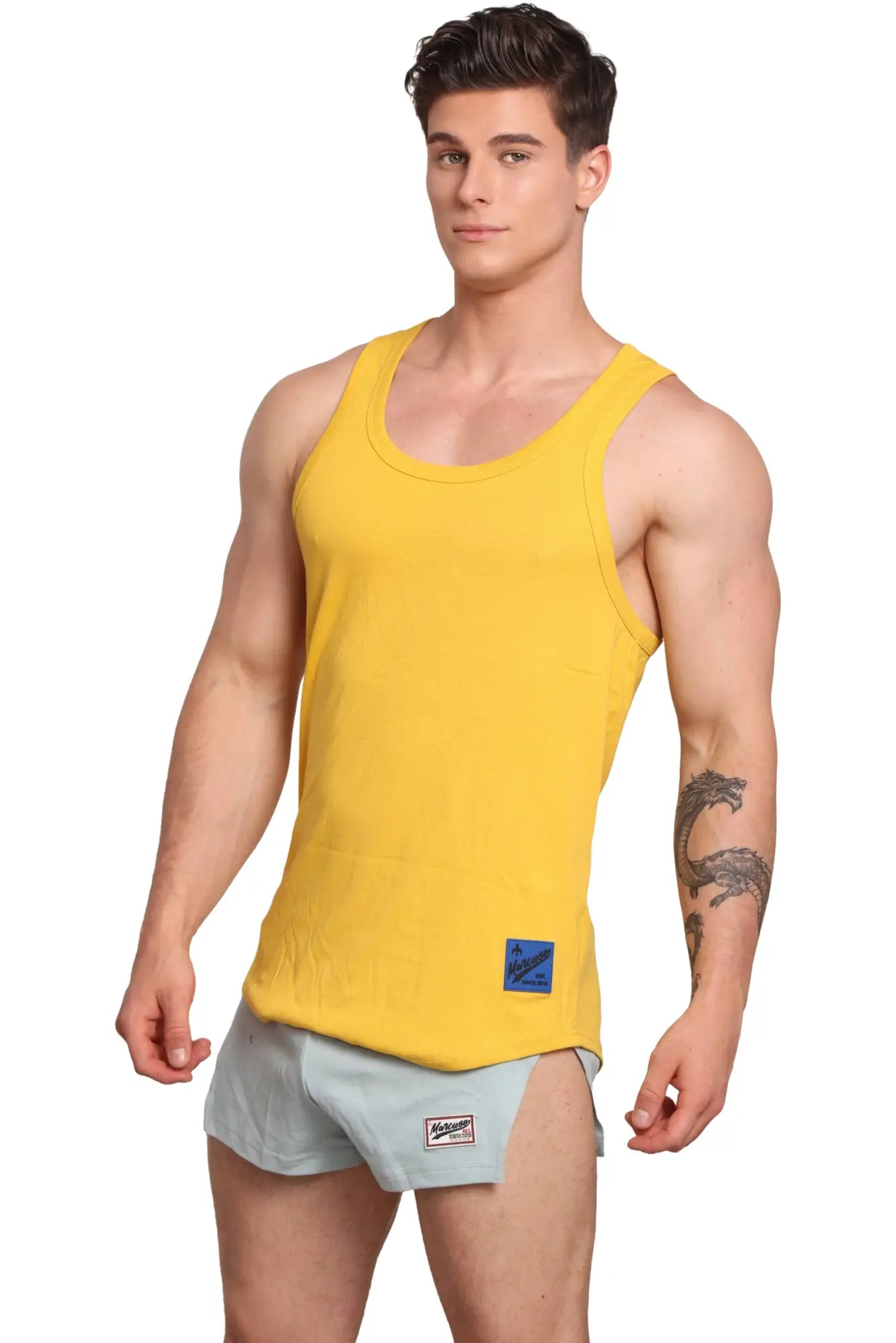 Marcuse monsieur tank top bright yellow sleeveless with round neckline and small blue label on lower front