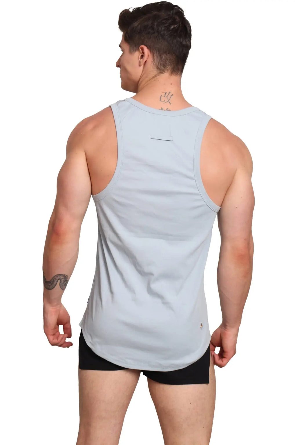 Light gray sleeveless marcuse monsieur tank top with subtle back pocket and minimal branding for athletic use