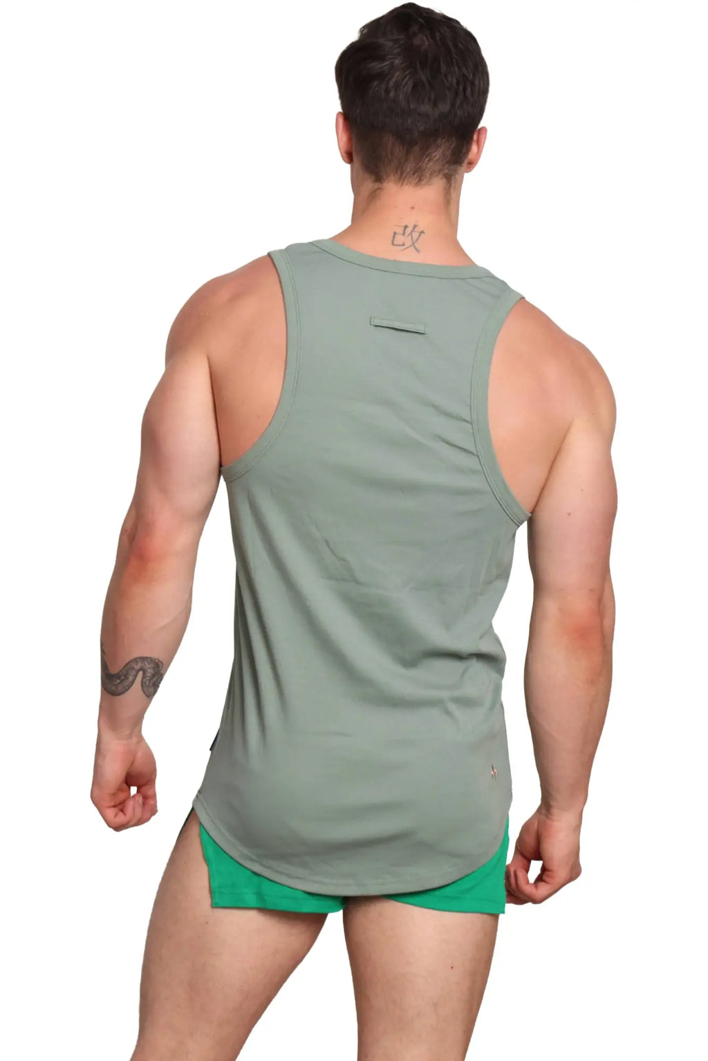Marcuse monsieur tank top in sleek olive green sleeveless design with subtle back pocket and minimalist style shown from back