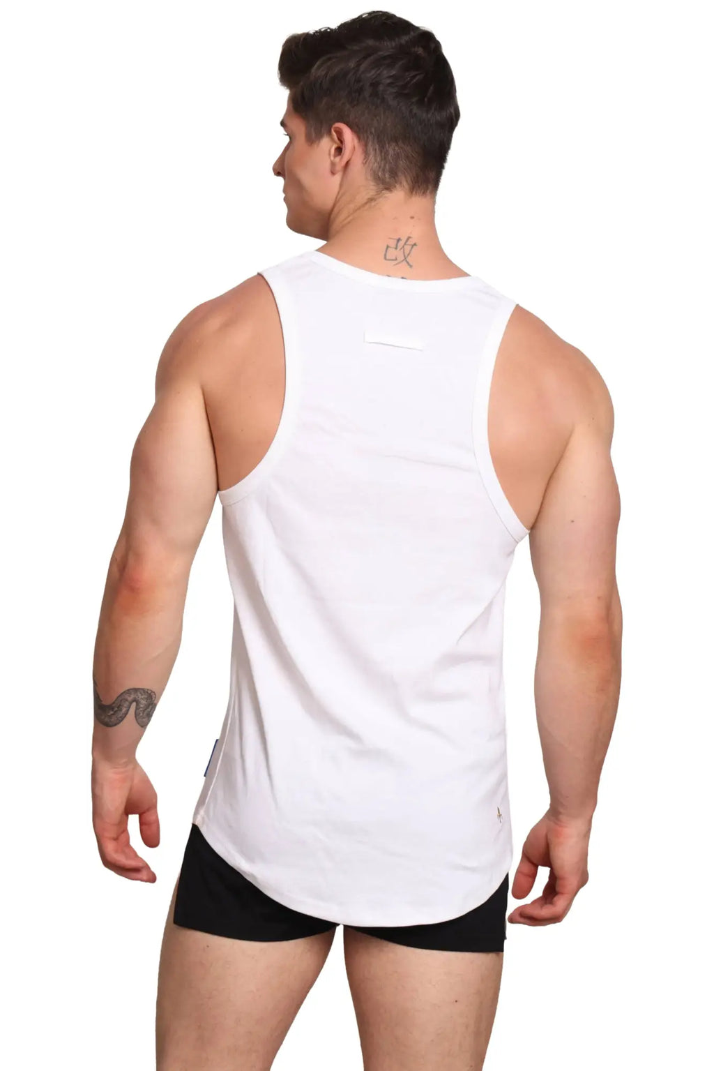 White sleeveless athletic tank top with rounded neckline and curved hem by marcuse monsieur for activewear