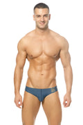 Blue men’s Marcuse Mpire bikini swimwear briefs with white m logo on waistband made for swimming and beachwear