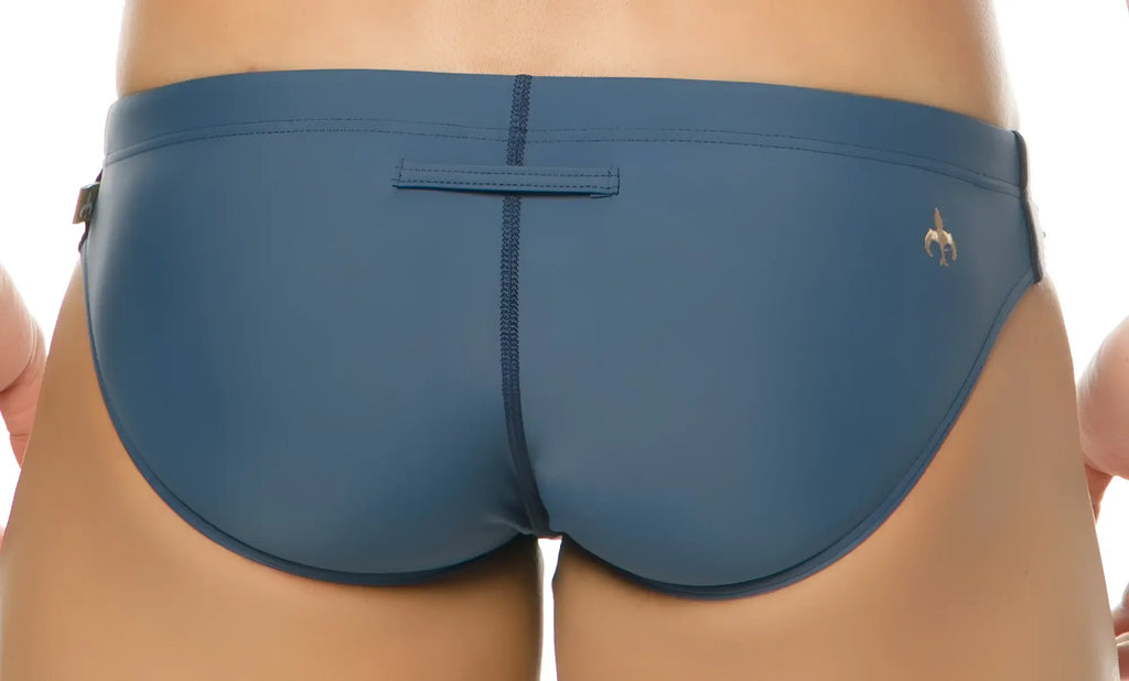 Blue Marcuse Mpire bikini swimwear trunks with a subtle gold logo on the lower right side for swim use