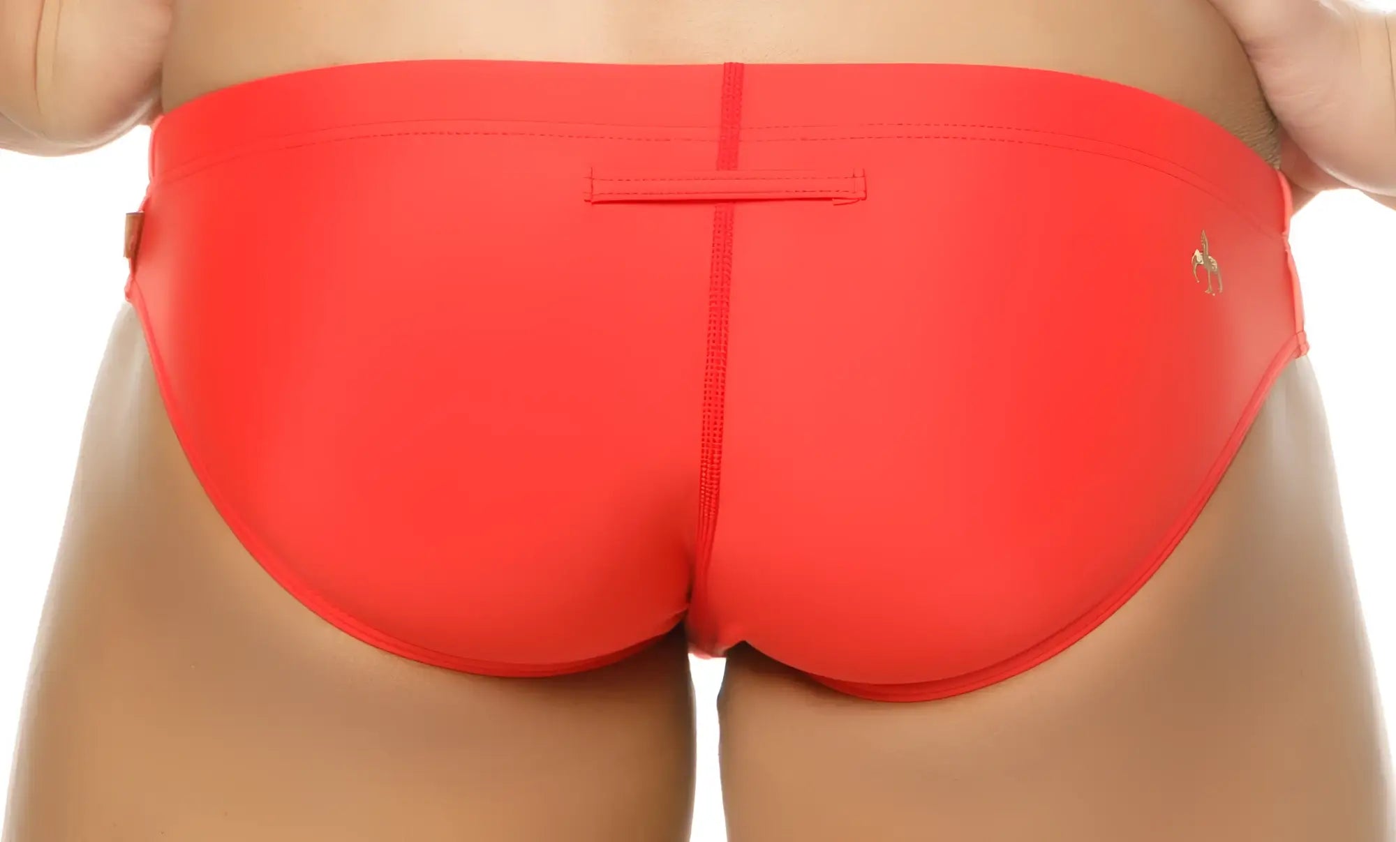 Bright red Marcuse Mpire bikini swimwear with sleek form-fitting trunks and a small gold logo on the side