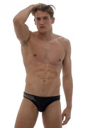 Black swim trunks from Marcuse Oasis bikini swimwear with delicate white leaf embroidery along the waistband