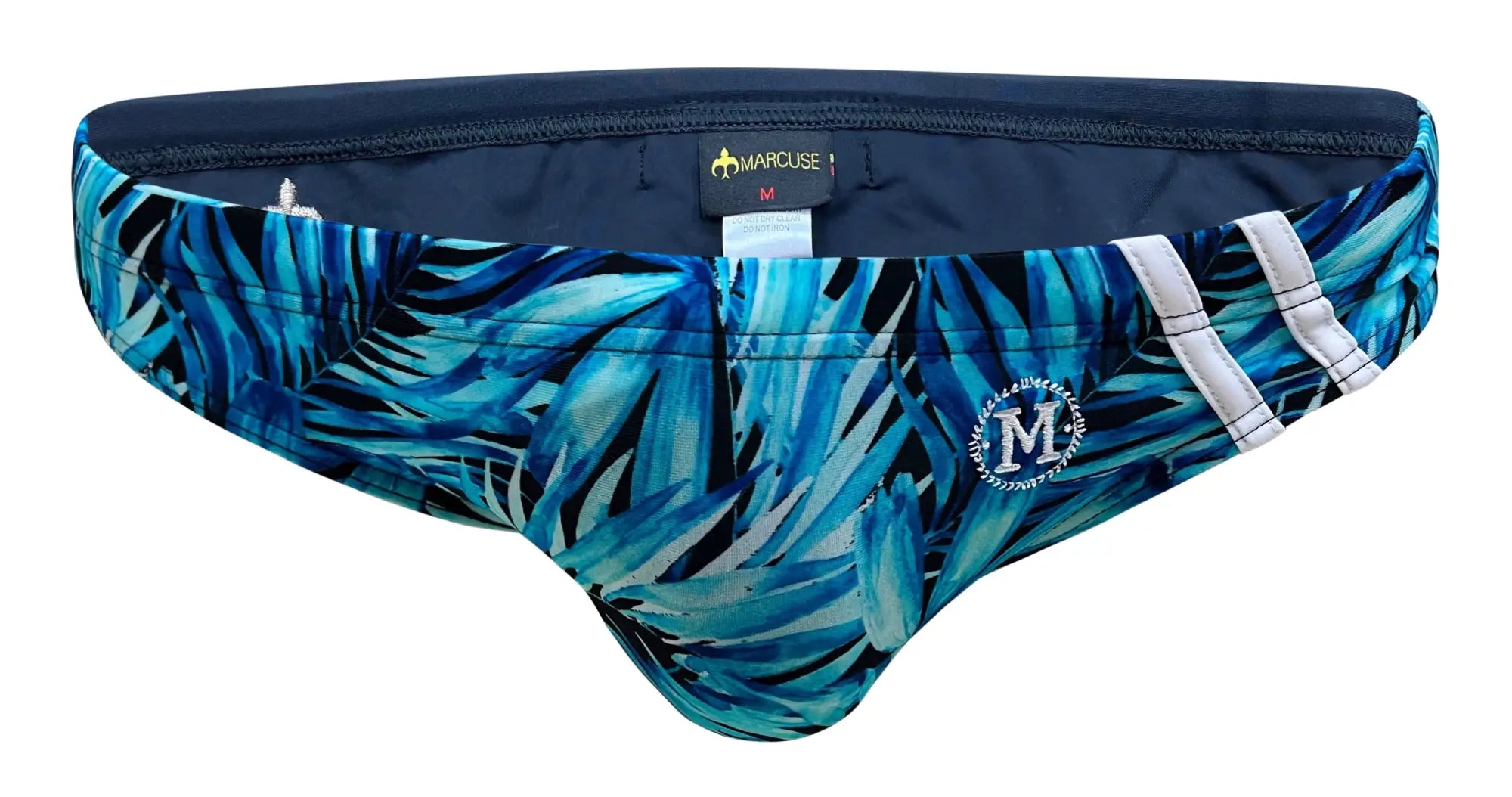 Blue tropical leaf patterned men’s swim trunks with white stripes and navy waistband by marcuse obelisk bikini swimwear