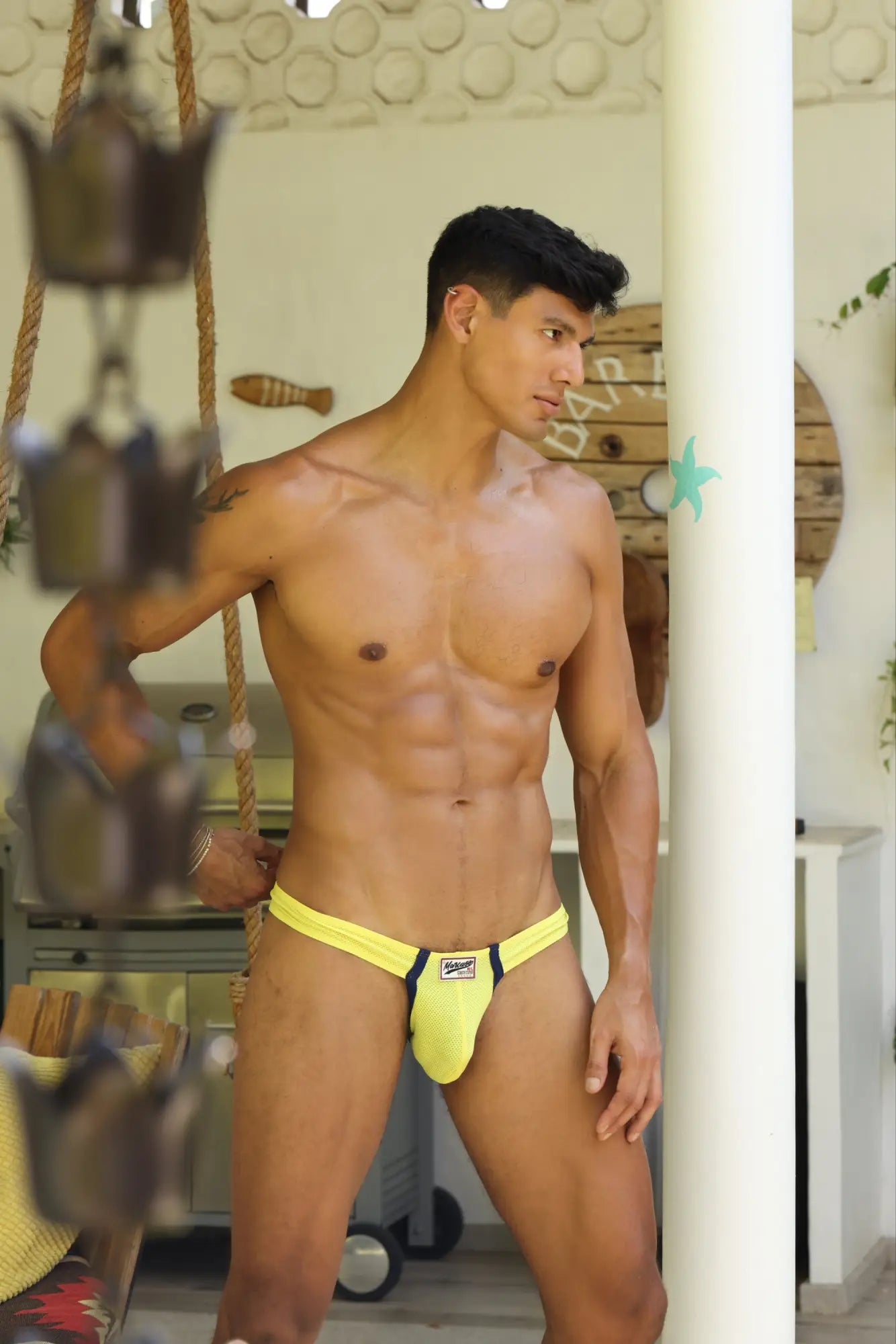 Marcuse Oscar thong underwear bright yellow athletic briefs with black trim and small front logo