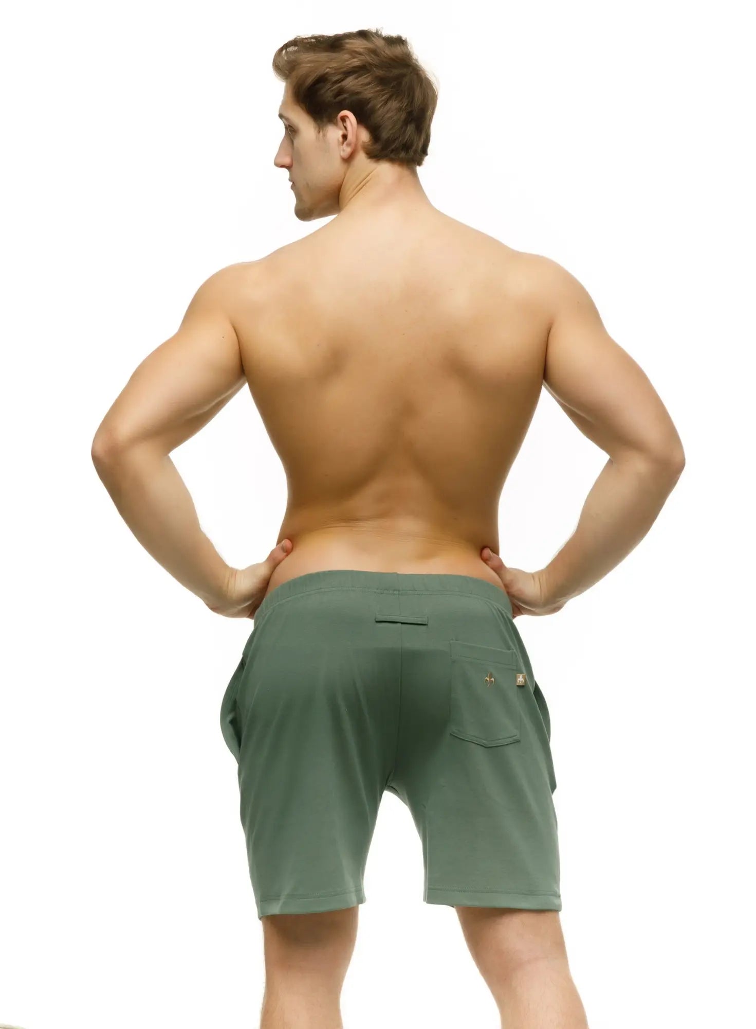 Back view of olive green marcuse oxford athletic shorts with subtle side pocket and small logo on back right hip