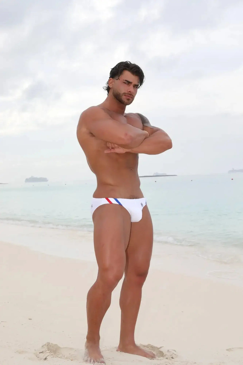 White marcuse panache bikini swimwear swim trunks with red blue and black side stripes for beachwear