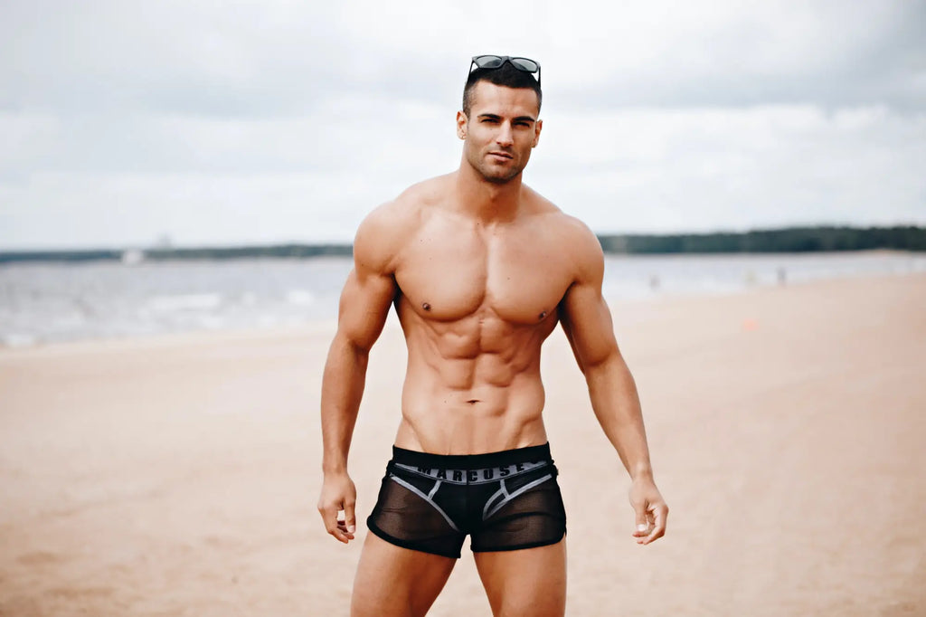 Black mesh swim trunks with silver trim and branded waistband marcuse panorama shorts for beachwear