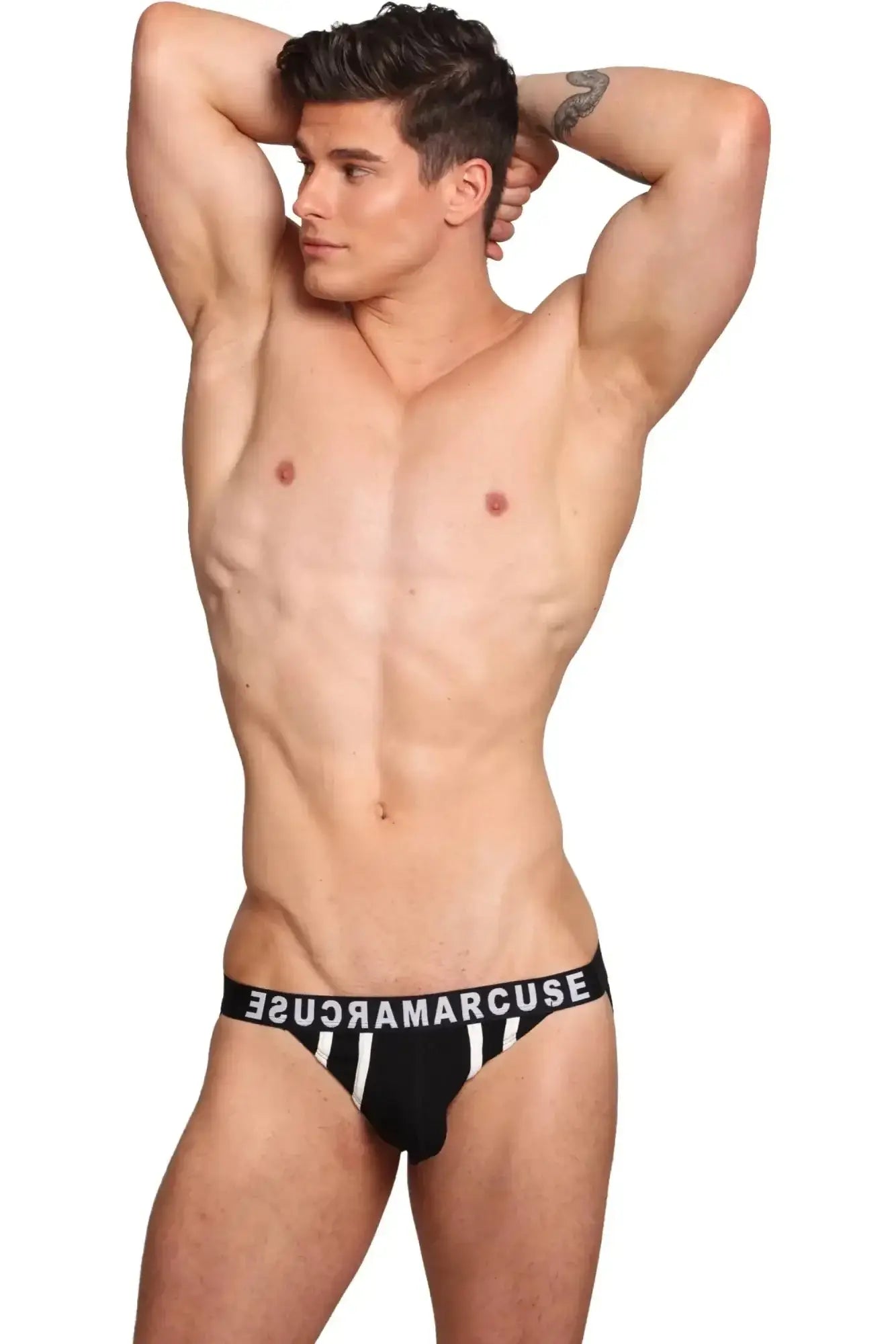 Black briefs with white vertical stripes and a black waistband branded sugar marcuse marcuse passant jock underwear